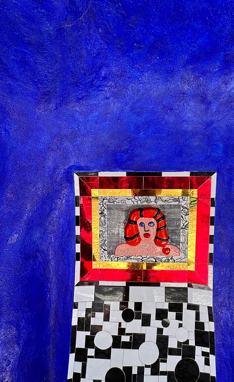 Three photos: A blue wall with a mosaic portrait of a woman with red hair, crying, the shiny blue and star tiled hair of the Empress. She has a red crown as well. The inside of the High Priestess. An open room tiled and painted blue. A hooded figure stands in the background.