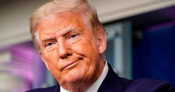 Trump faces backlash for removing mask on return to White House