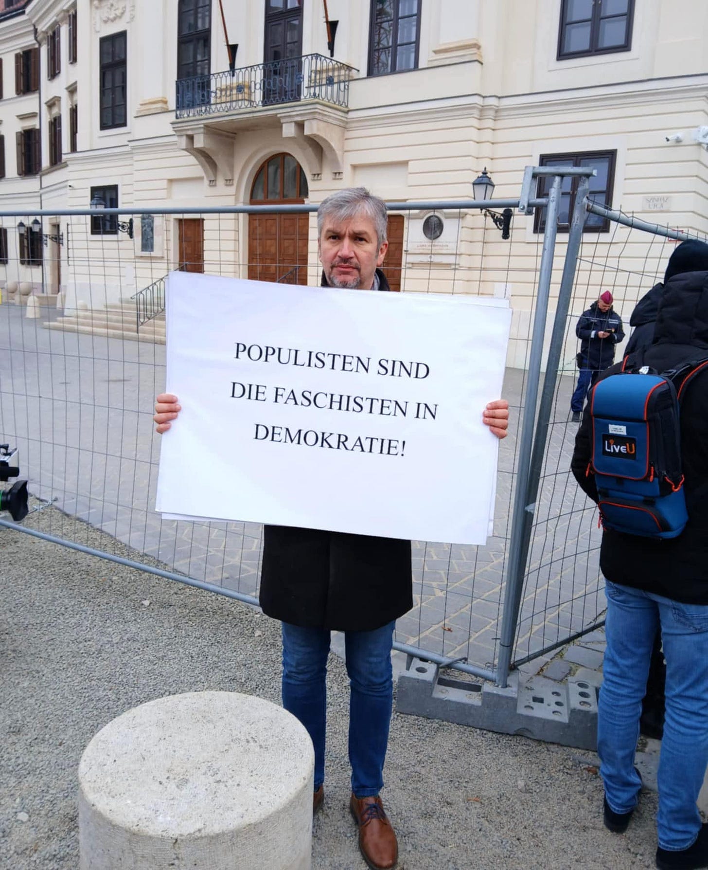May be an image of 3 people, the Brandenburg Gate and text