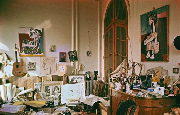 This may contain: a room filled with lots of clutter and pictures