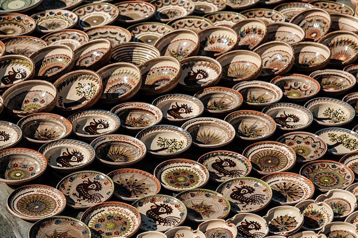 Lines and lines of empty ceramic bowls and plates. Lines and lines of empty ceramic bowls and plates.