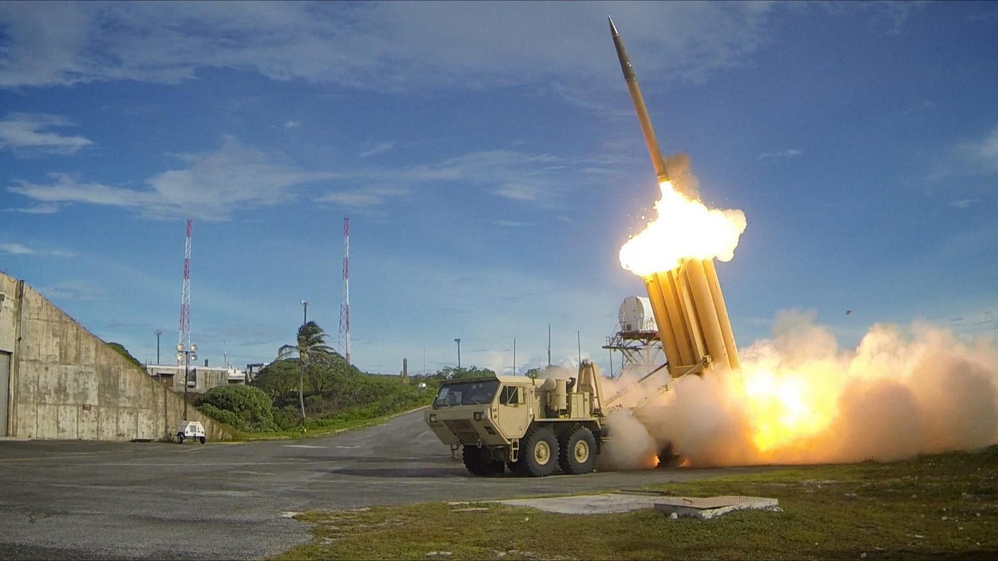 A THAAD missile defense system launches an interceptor A THAAD missile defense system launches an interceptor