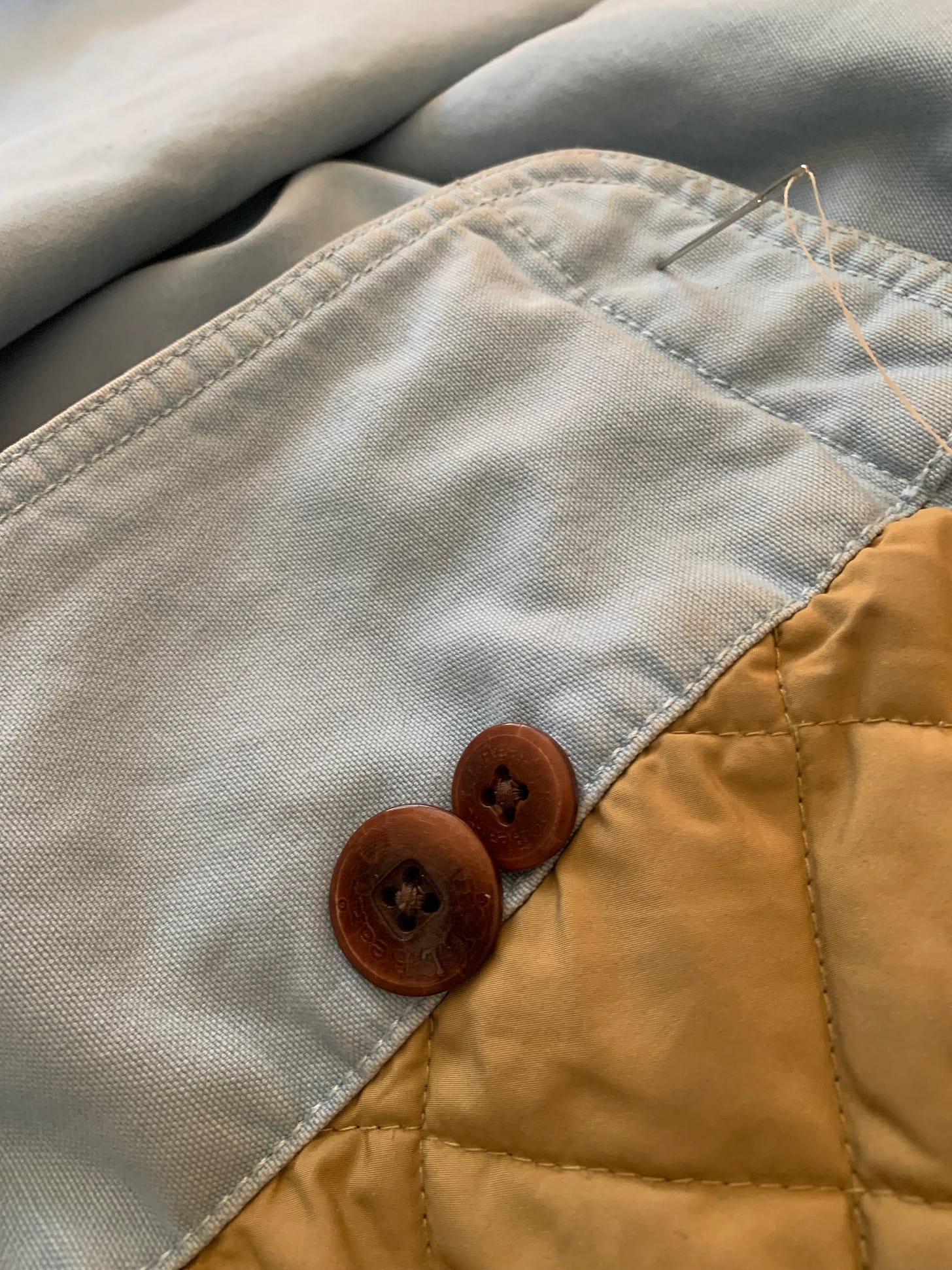 extra buttons on hem of jacket