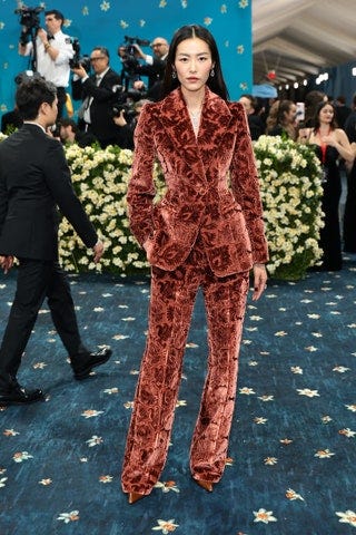 Image may contain Liu Wen Andrea Zorzi Tarla Dalal Person Clothing Formal Wear Suit Adult Footwear Shoe and Glove