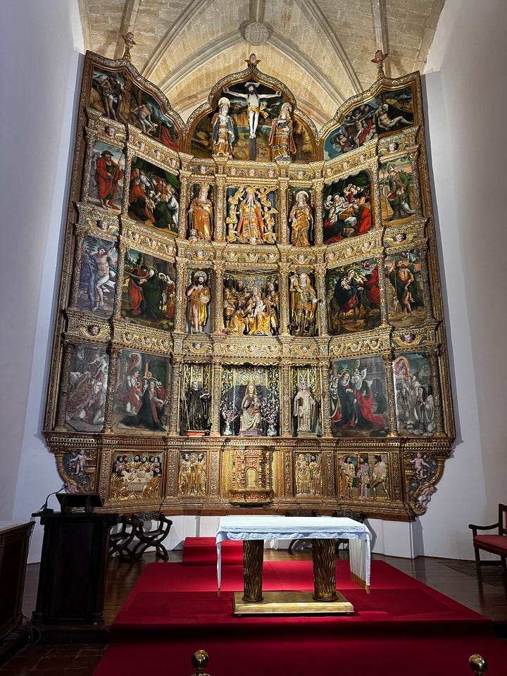 Inside the chapel at the Monasterio de Santa María, Renaissance altarpiece, 15th century Madonna and Child statue, and the tomb of Doña Urraca López de Haro.