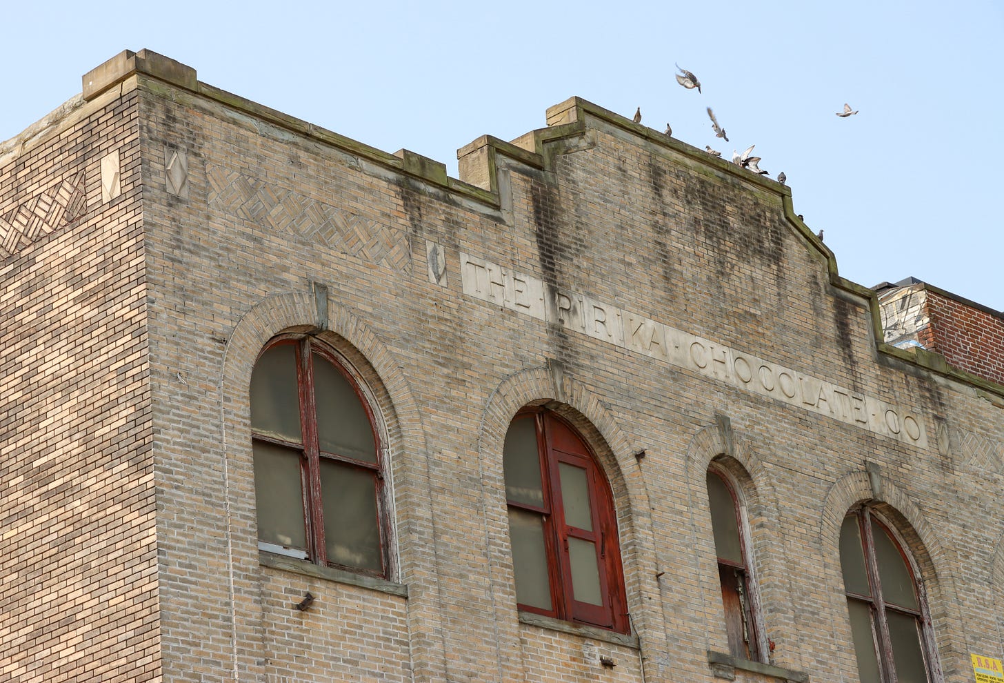 pirika chocolate company sign on a brick building