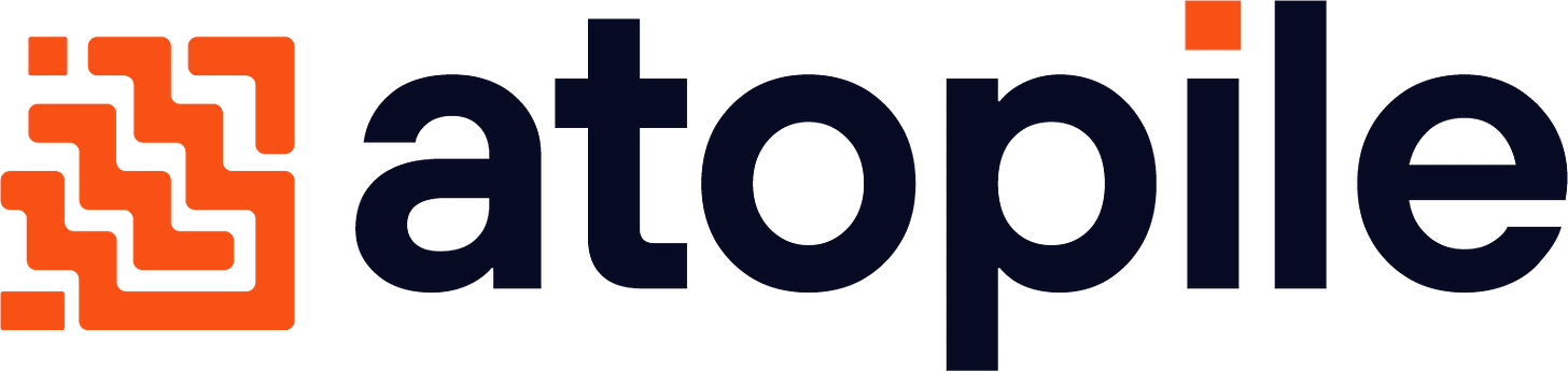 Shows a black logo in light color mode and a white one in dark color mode.