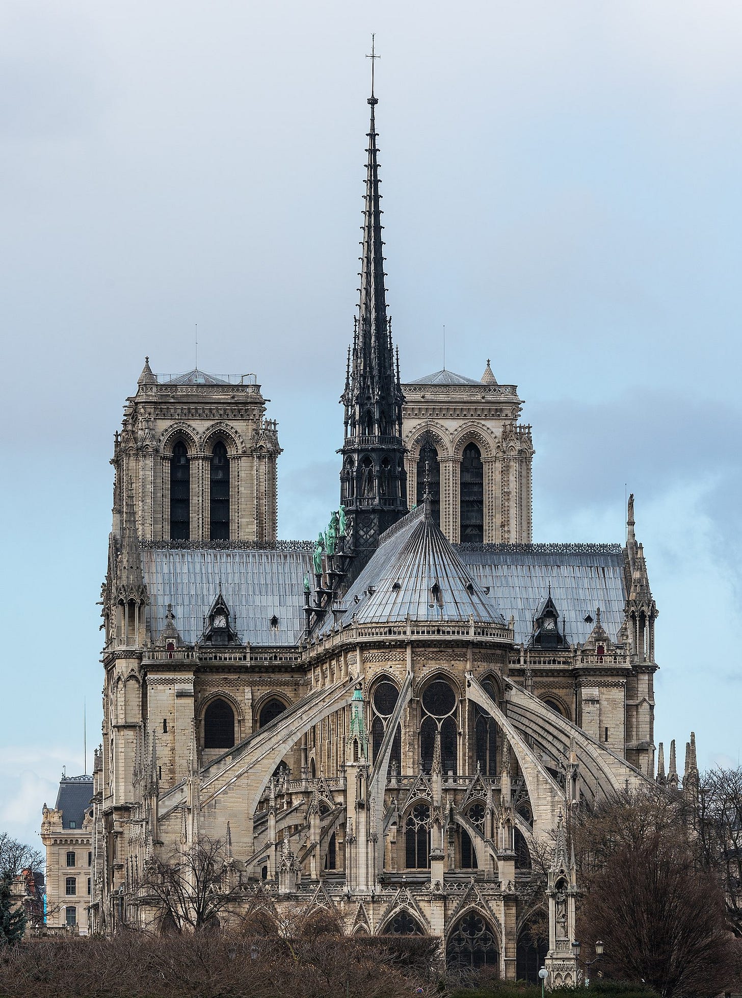 East view of Notre Dame Cathedral in Paris, highlighting its Gothic spires, flying buttresses, and detailed stonework. East view of Notre Dame Cathedral in Paris, highlighting its Gothic spires, flying buttresses, and detailed stonework.