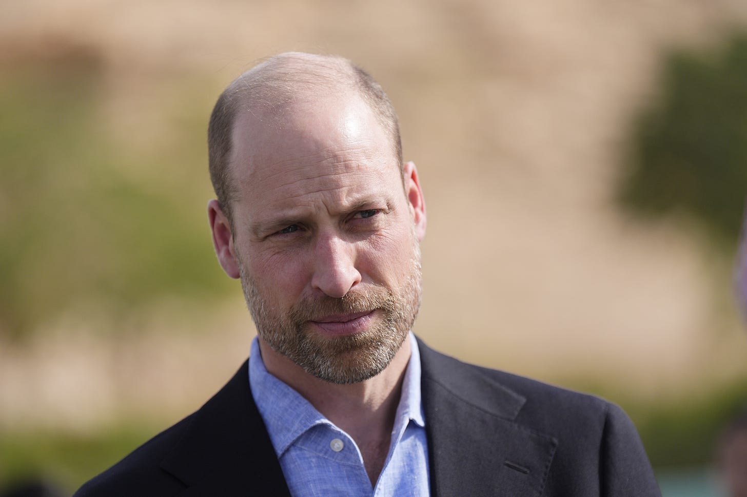 Prince William frowning in a suit