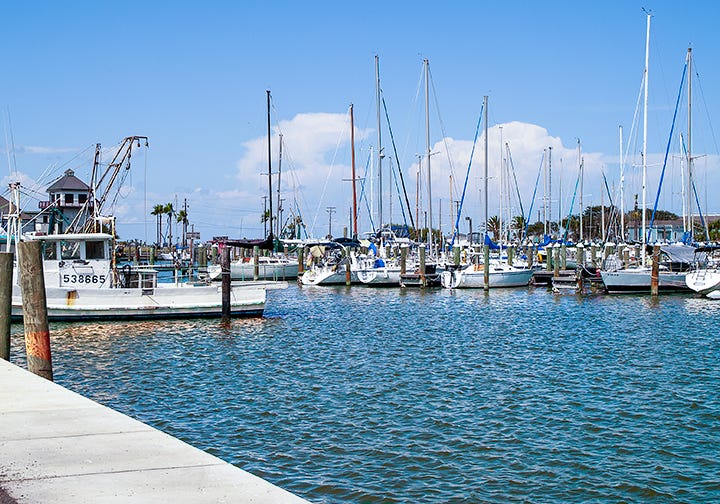Left: photo of the Rockport marina at Little Bay; right: photo of Mom's Bait Shop, a popular stop at the local marina.