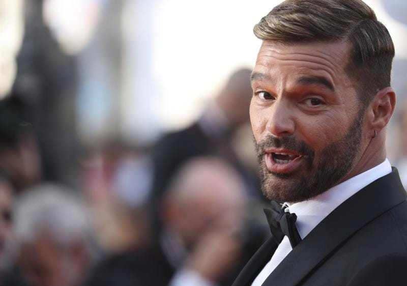 FILE - Ricky Martin poses for photographers upon arrival at the premiere of the film 'Elvis' at the 75th international film festival, Cannes, southern France, May 25, 2022.  A judge has issued a restraining order against Martin, police said Saturday, July 2, 2022. (Photo by Vianney Le Caer/Invision/AP File)