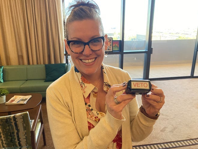 Arizona Gov. Katie Hobbs holds a veto stamp used by the state's last Democratic governor, Janet Napolitano. The stamp was a gift after Hobbs won election to the state's top office in 2022. Arizona Gov. Katie Hobbs holds a veto stamp used by the state's last Democratic governor, Janet Napolitano. The stamp was a gift after Hobbs won election to the state's top office in 2022.