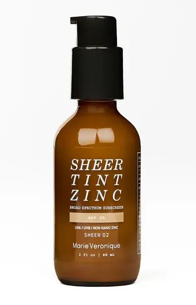 Sheer Tint Zinc in a translucent brown pump bottle.