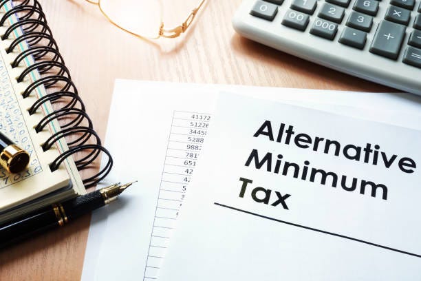 Alternative Minimum Tax (AMT) and calculator on a desk. Alternative Minimum Tax (AMT) and calculator on a desk. minimum tax stock pictures, royalty-free photos & images Alternative Minimum Tax (AMT) and calculator on a desk. Alternative Minimum Tax (AMT) and calculator on a desk. minimum tax stock pictures, royalty-free photos & images