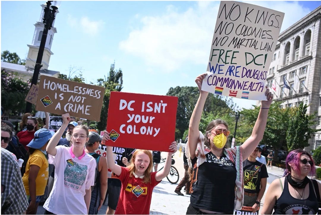 A group of people holding signs

AI-generated content may be incorrect.
