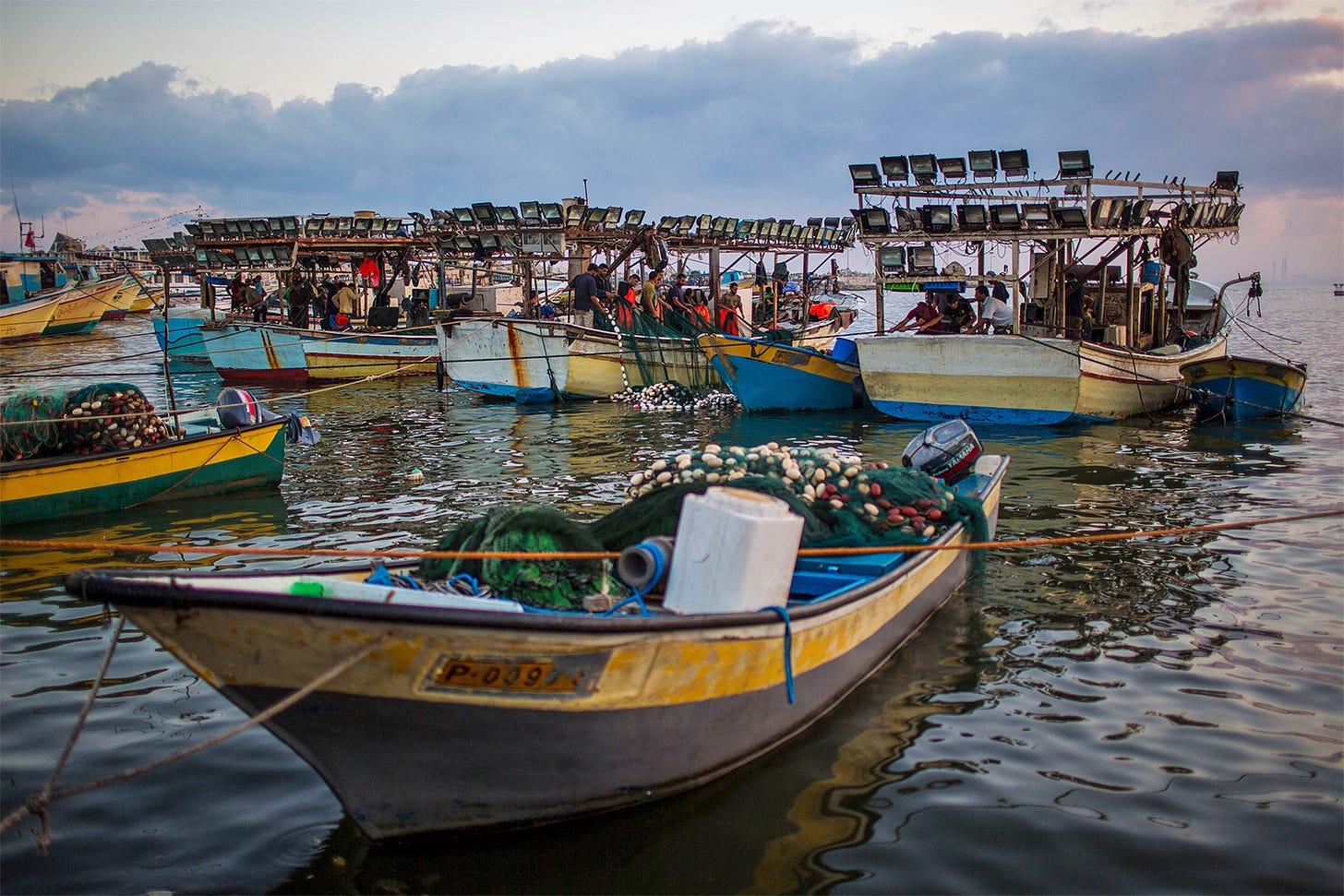 Fishing vessels in Gaza’s port circa 2014. Since the start of the 2023 war, the Israeli military has systematically attacked fishers in Gaza and destroyed the port, landing sites and other fishing infrastructure, leaving the industry in a state of “collapse,” according to the United Nations. Image by Wissam Nassar, ©Save Our Seas Foundation. Fishing vessels in Gaza’s port circa 2014. Since the start of the 2023 war, the Israeli military has systematically attacked fishers in Gaza and destroyed the port, landing sites and other fishing infrastructure, leaving the industry in a state of “collapse,” according to the United Nations. Image by Wissam Nassar, ©Save Our Seas Foundation.