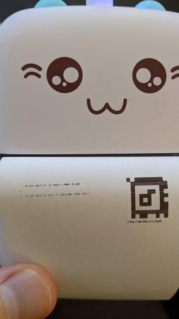 cat printer being used to print out Folk programs!