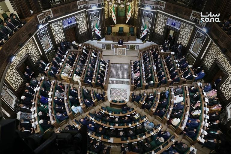 Syria's President Ahmed al-Sharaa (top, C) speaking during the first meeting of Syria's new transitional parliament in Damascus Syria's President Ahmed al-Sharaa (top, C) speaking during the first meeting of Syria's new transitional parliament in Damascus