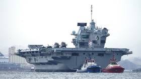 Britain’s flagship aircraft carrier catches fire en route for repairs