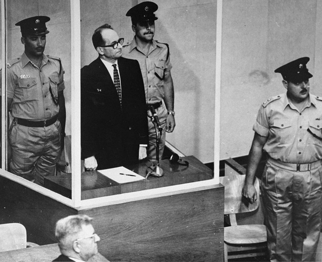 A person standing in front of a person in uniform
AI-generated content may be incorrect.