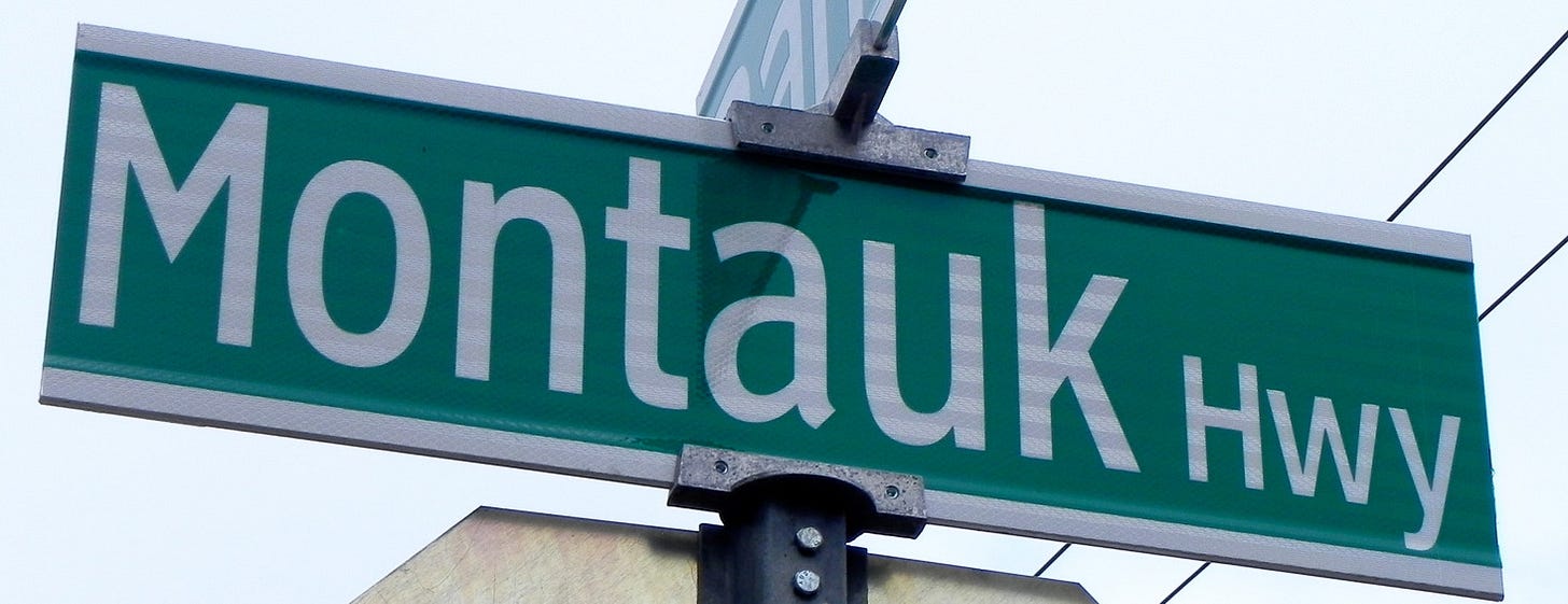Close up of a street sign reading Montauk Hwy. Close up of a street sign reading Montauk Hwy.