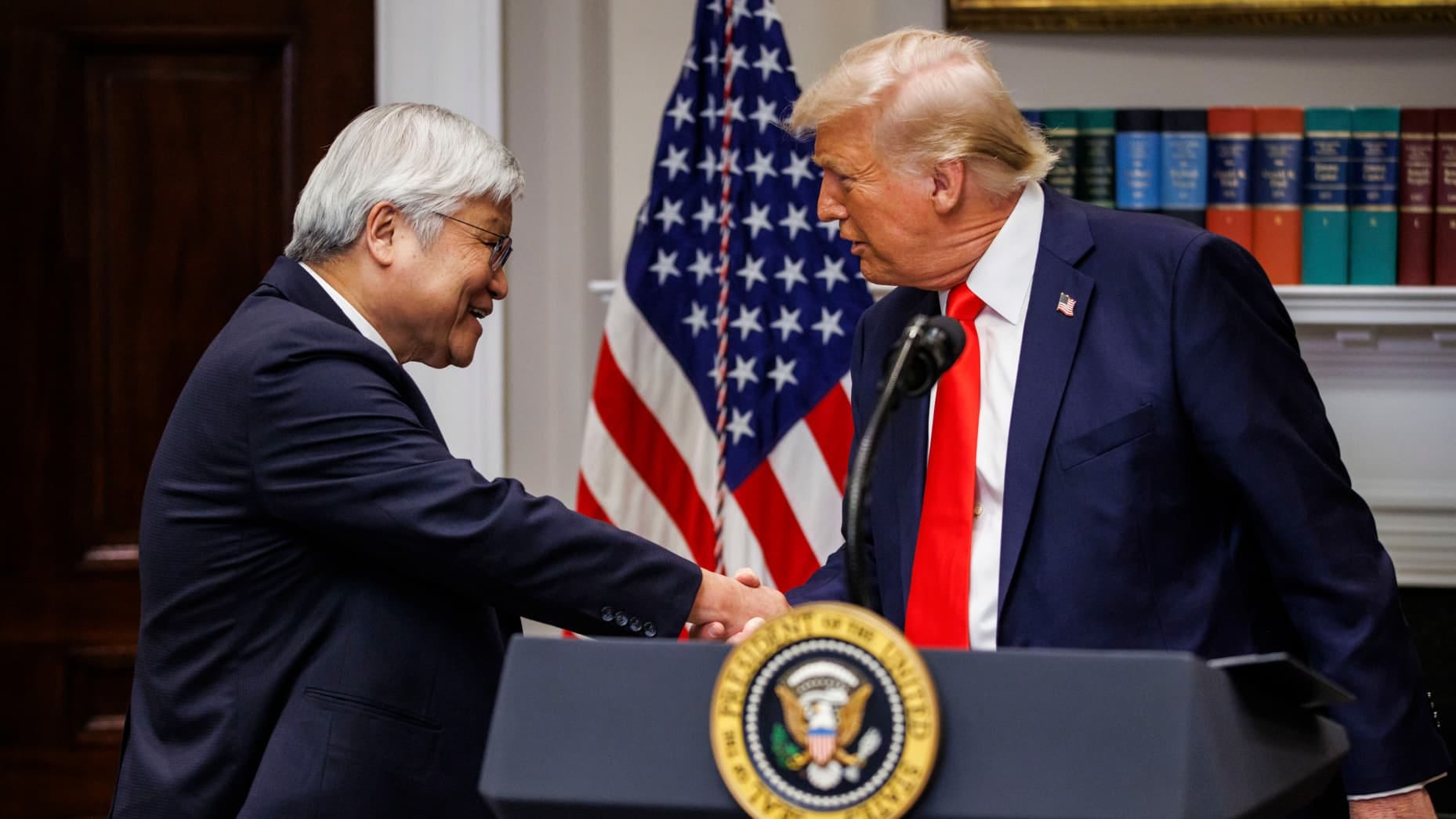 US President Donald Trump, right, and C.C. Wei, chief executive officer of Taiwan Semiconductor Manufacturing Co. (TSMC), shake hands during an investment announcement in the Roosevelt Room of the White House in Washington, DC, US, on Monday, March 3, 2025. Taiwan Semiconductor Manufacturing Co., the world's top producer of AI chips, plans to invest an additional $100 billion in US plants that will boost its chip output on American soil and support President Donald Trump's goal of increasing domestic manufa