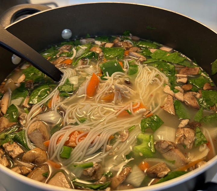 can of lee kum king chicken bouillon powder, full hand cart at korean grocery store, pot of korean noodles and green vegetables, mushrooms and chicken, hand-painted ramen sign hangs above shelves of ramen