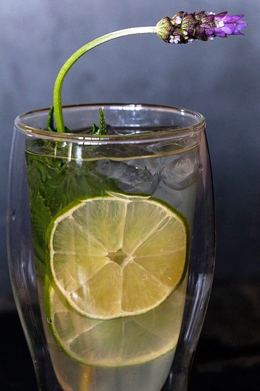 limeade garnished with a sprig of lavender