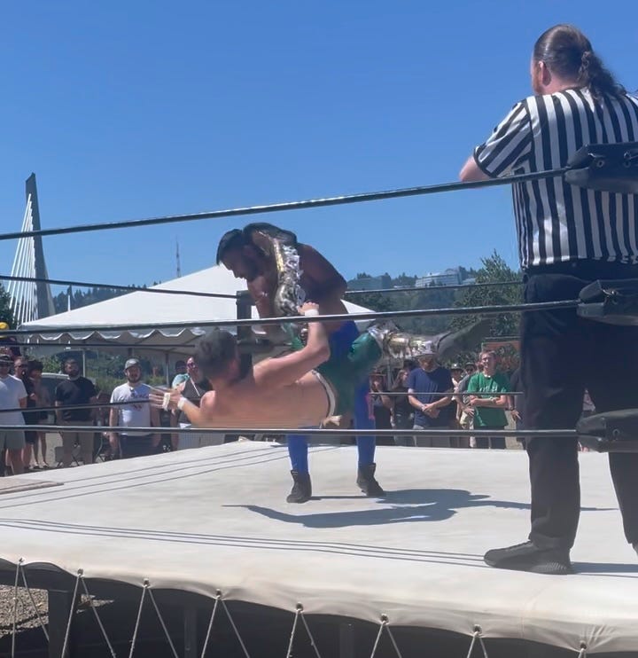 Photo of wrestler throwing down another wrestler Photo of wrestler throwing down another wrestler