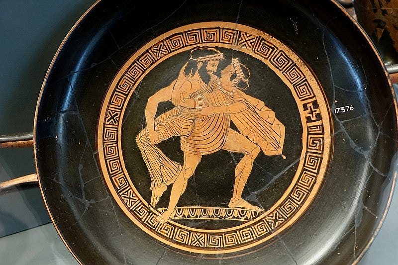 color photograph of a red figure vase with a bearded figured carrying off a woman in robes