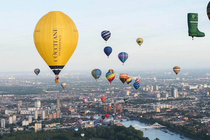 Hot air balloons floating across London Hot air balloons floating across London