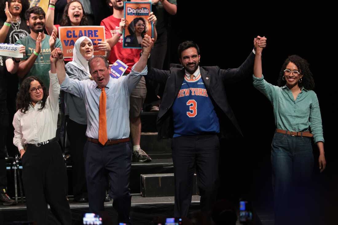 Congressional candidates Claire Valdez, Brad Lander and Darializa Avila Chevalier raise their hands with New York Mayor Zohran Mamdani during a Get Out the Vote rally on June 18, 2026 in New York City.