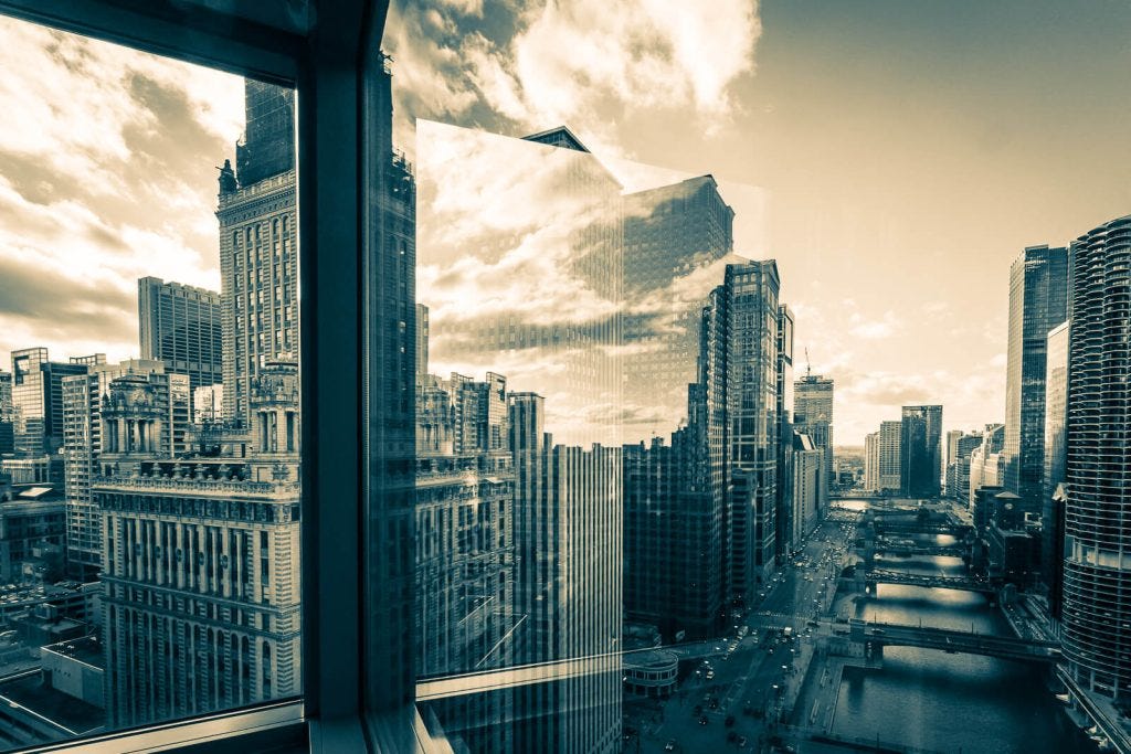 Chicago River reflection from corner window in hotel