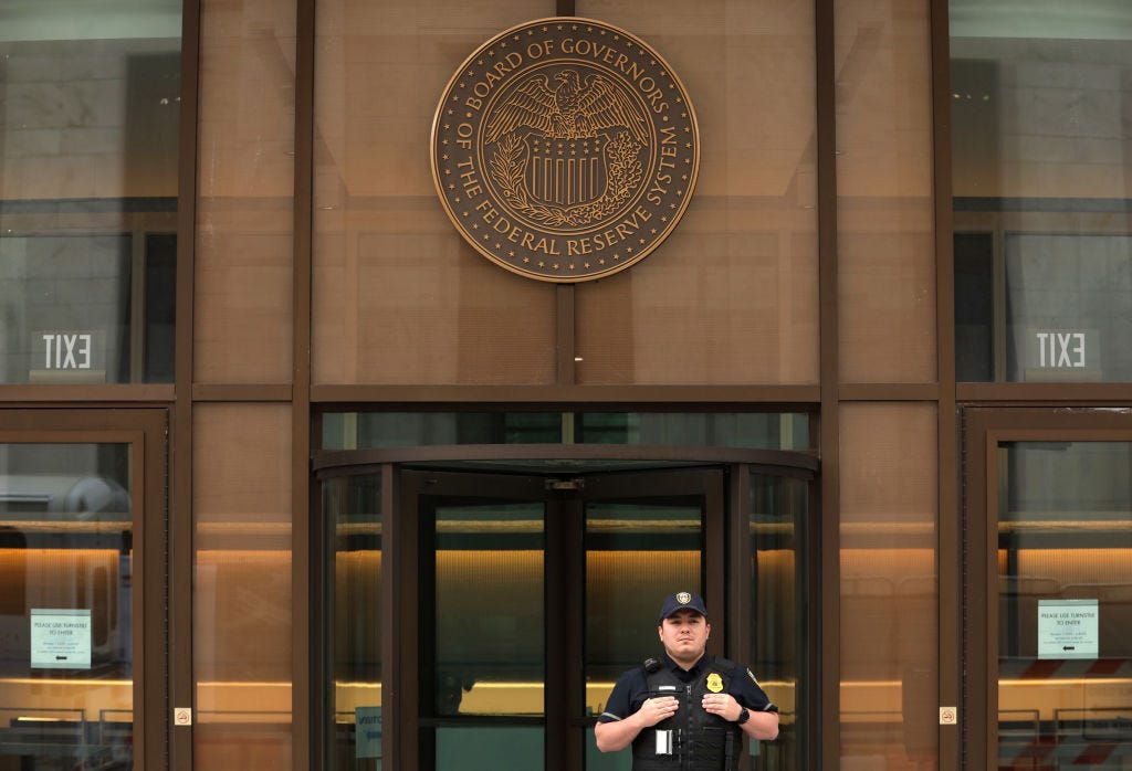 Federal Reserve police officer guards the entrance to the Federal Reserve’s William McChesney Martin Building