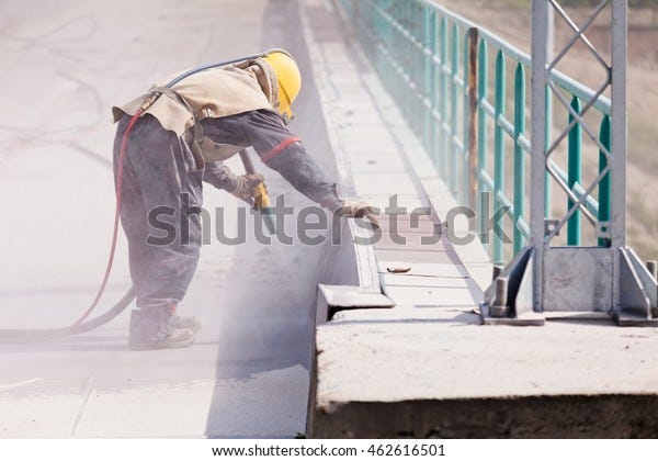 blasting of concrete, note shallow depth of field