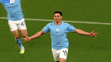 a soccer player wearing a blue etihad airways jersey