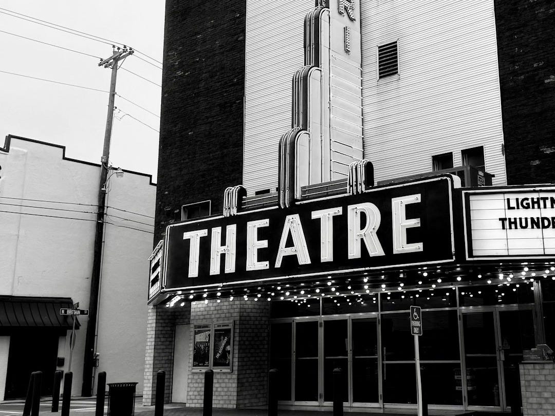 A vintage theatre building stands tall.