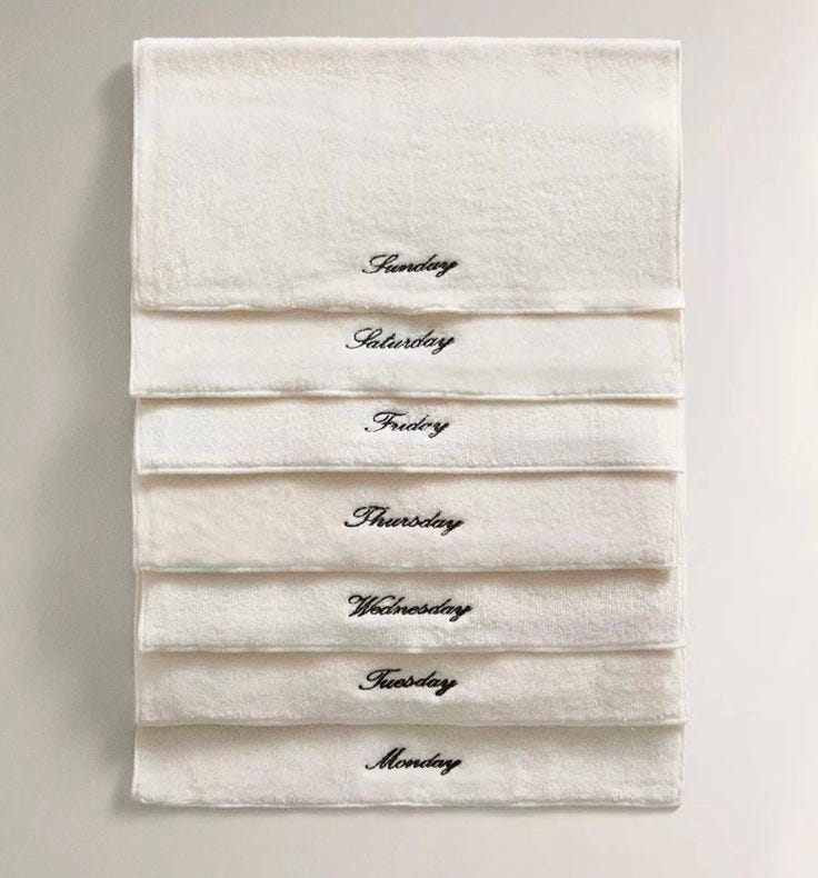 This may contain: three folded towels with the words one for each day of the week, i love This may contain: three folded towels with the words one for each day of the week, i love