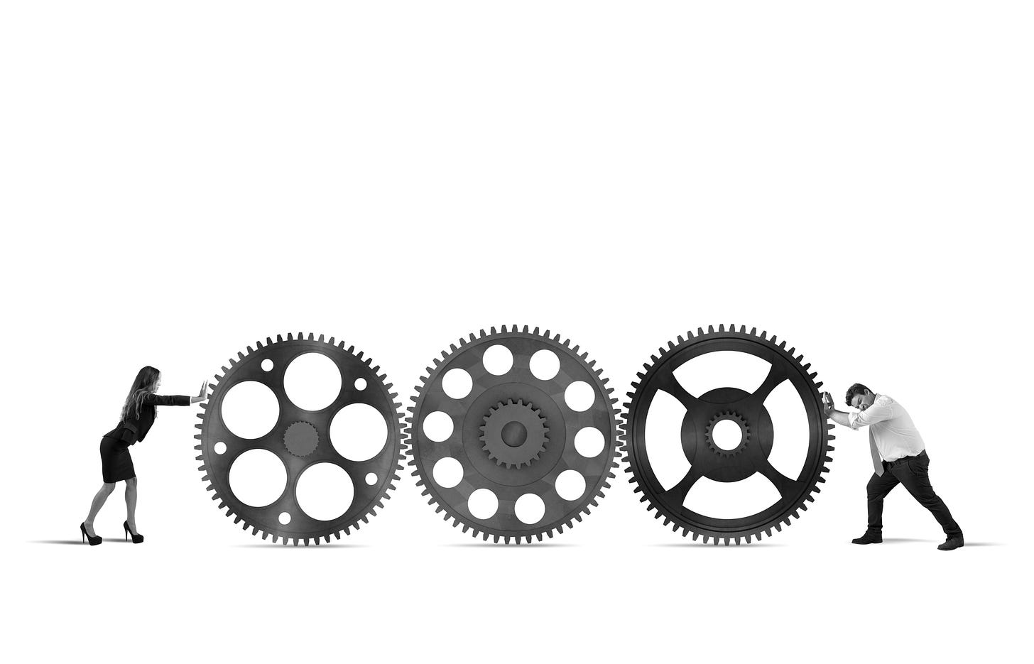 People pushing misaligned gears representing system breakdown