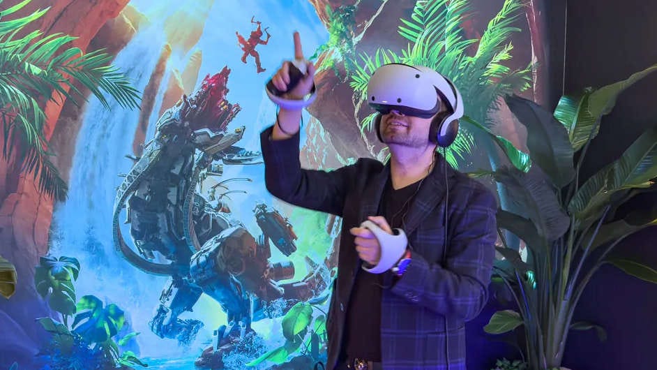 A man wearing PSVR 2 playing a game A man wearing PSVR 2 playing a game