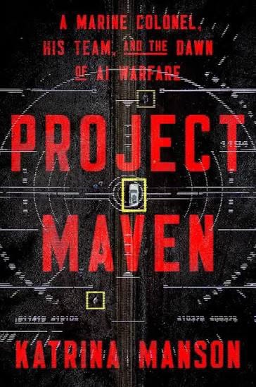 Book cover of Project Maven: A Marine Colonel, His Team, and the Dawn of AI Warfare by Katrina Manson. The cover features large red block letters spelling "PROJECT MAVEN" over a dark, textured background resembling an aerial surveillance image or digital targeting display. Thin white interface lines, targeting boxes, and data overlays evoke artificial intelligence, military intelligence, and computer vision. Above the title, the subtitle reads, "A Marine Colonel, His Team, and the Dawn of AI Warfare." The author's name, Katrina Manson, appears in bold red letters at the bottom. The overall design conveys a modern military AI and surveillance theme.