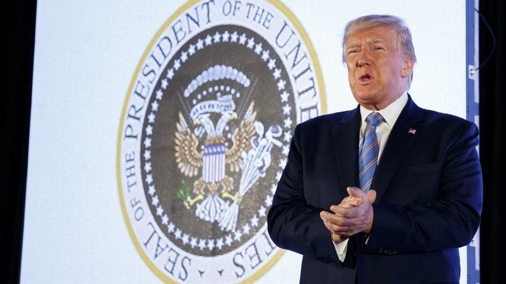 President Donald Trump arrives to speak, with an altered presidential seal behind him, at Turning Point USA's Teen Student Action Summit 2019, Tuesday, July 23, 2019, in Washington. (AP Photo/Alex Brandon)