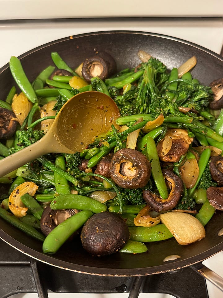 colorful home made meals, salmon, rice pilaf, mushrooms and broccoli rabe and pasta with greens
