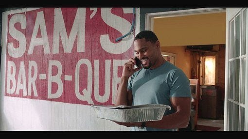 Trey carrying barbecue chili out from Sams Bar B Que. Trey carrying barbecue chili out from Sams Bar B Que.