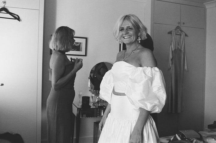 A bride getting dressed before her wedding