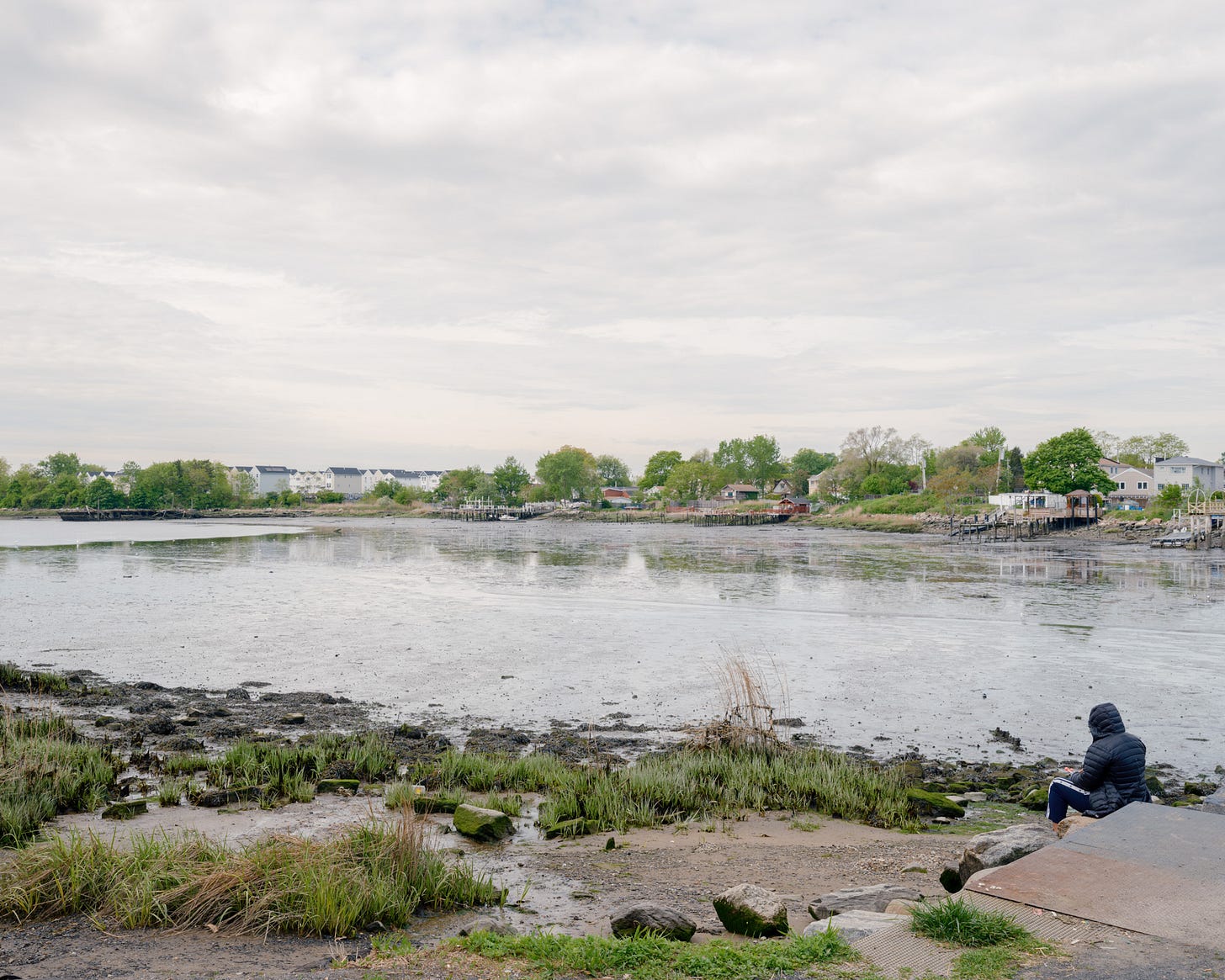 woman-sitting-looking-at-pugsley-creek-