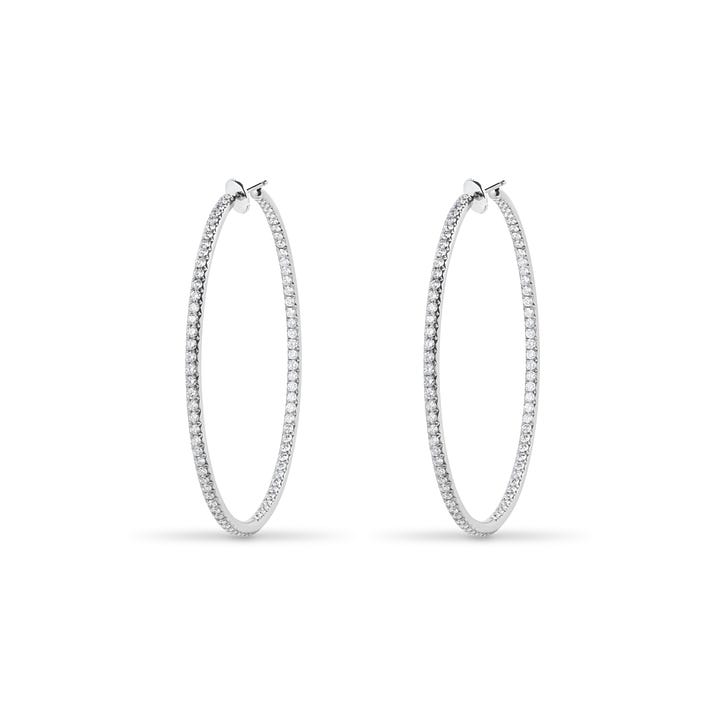 codebyEdge titanium and diamond code hoops, alongside the gold originals designed in 2011 for Sade
