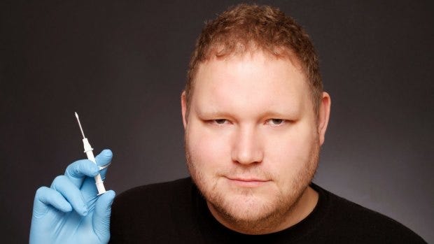 Amal Graafstra holding a large hypodermic needle - the kind needed to inject an RFID chip into your hand. Amal Graafstra holding a large hypodermic needle - the kind needed to inject an RFID chip into your hand.