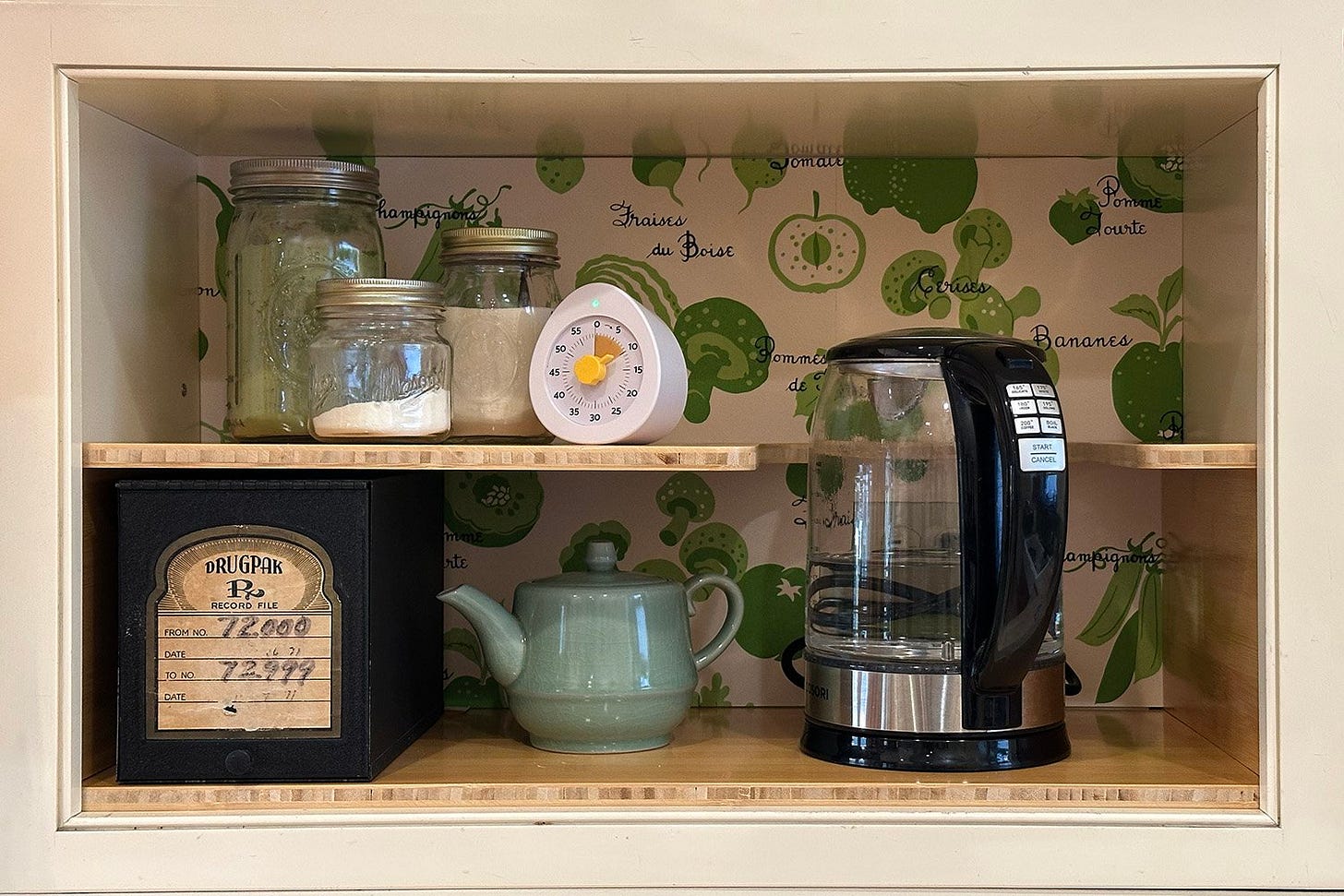 Coffee and tea nook with bamboo shelves, vintage shelf liner, jars, kettle, and an old Rx box. Coffee and tea nook with bamboo shelves, vintage shelf liner, jars, kettle, and an old Rx box.