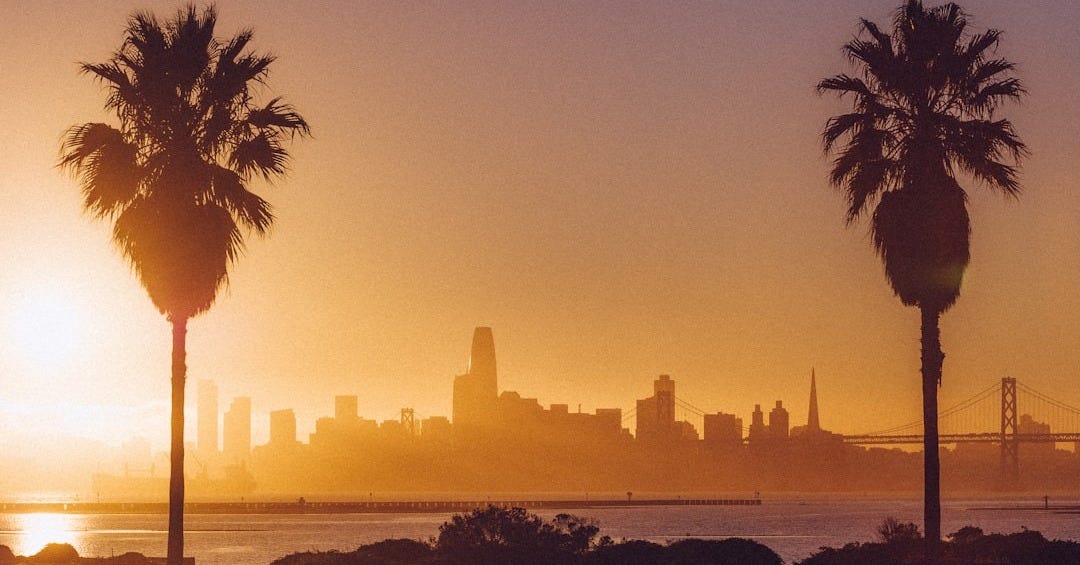 silhouette of city skyline during sunset